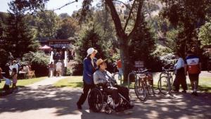 ADA Accessibility woman pushing man in wheelchair
