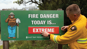 Fire Fighter with Fire Danger Sign