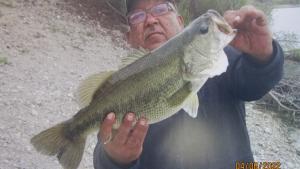 Fisherman holding 5.4lb largemouth bass