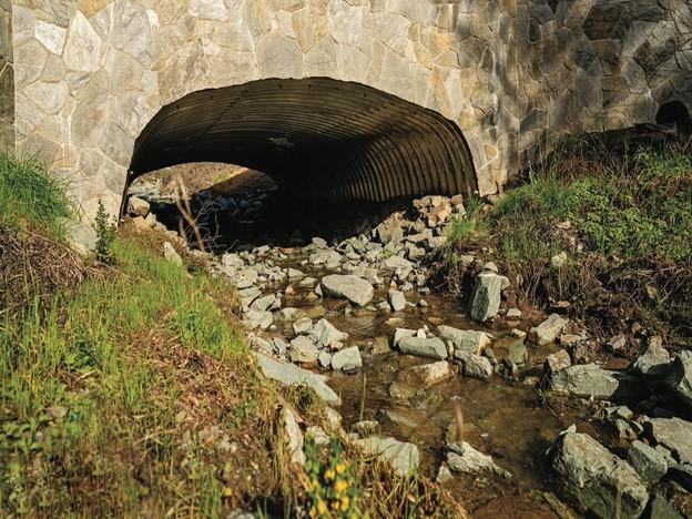 An open bottom arch culvert crosses Alder Creek 