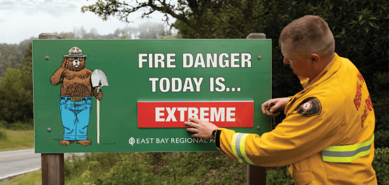 Fire Fighter with Fire Danger Sign