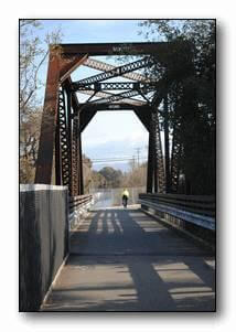 Iron Horse Trail biker on bridge