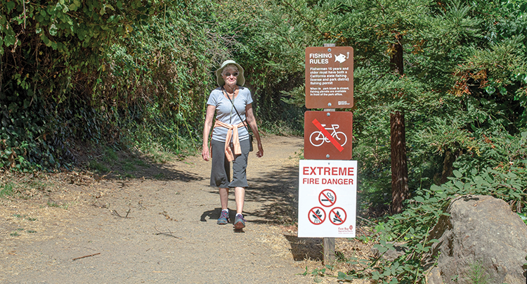 Park fire sign and Woman walking