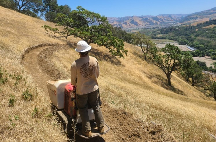 EBRPD worker cutting a new trail on Tyler Ranch