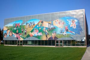 mural on building beside lawn