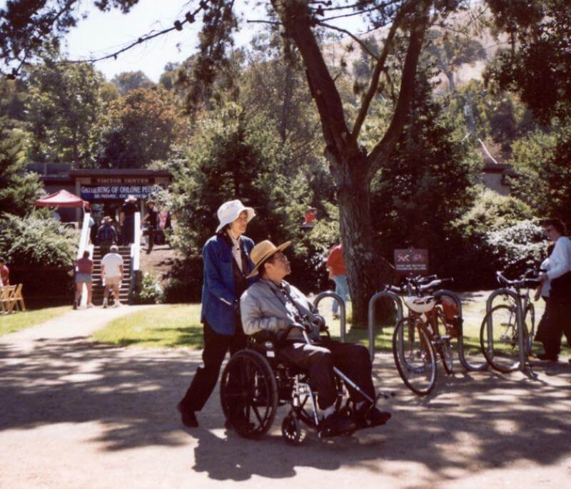 ADA Accessibility woman pushing man in wheelchair